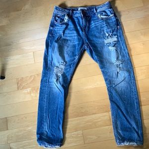 Zara ripped jeans.